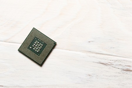 wooden background on it is a processor for microchips. close-up. view from above.の写真素材