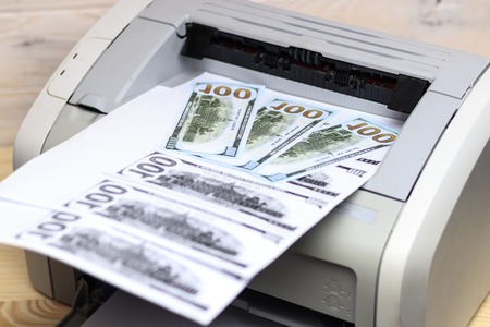 printed dollars. home printer. concept crime fake money
