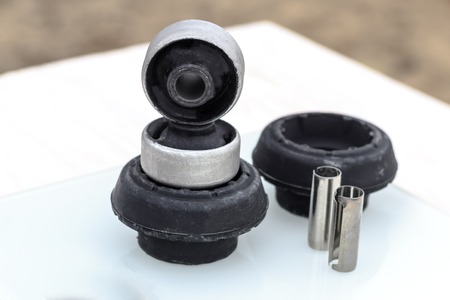 shock absorber support. silent block. metal sleeve. close-up. shallow depth of field.