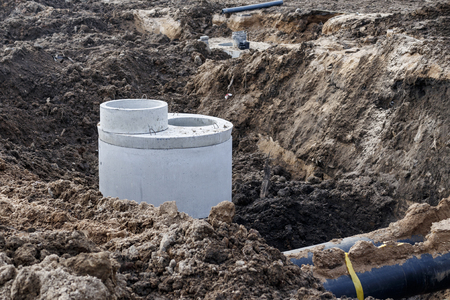 industrial facility. pipes are being laid, and a well is put in place for long-term maintenance.の写真素材