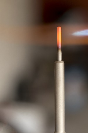 master in blue gloves check the candle. engine compartment in the car. close-up.の写真素材