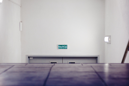 ladder bottom door. at the top of the output inscription, in Russian. the camera takes off from the floor levelの写真素材