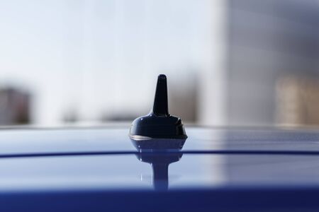 daylight. car. on the roof in the form of a fin antenna