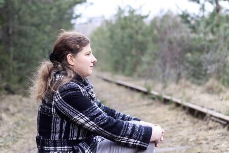 girl. Railway. Spring. she walks along the paths have toningの写真素材