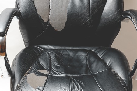 leather office chair on a white background. no isolation. repairs. hauling upholstery.の写真素材