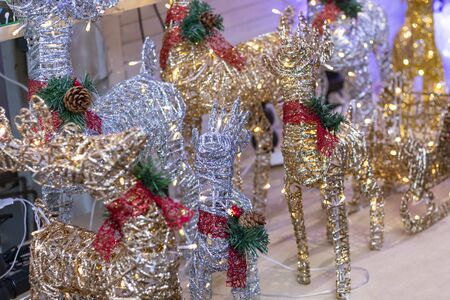 close-up. a toy made of wire and strewn with sparkles, inside a garland. holiday symbolの写真素材