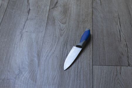 the knife lies on the floor. close-up. domestic violence conceptの写真素材