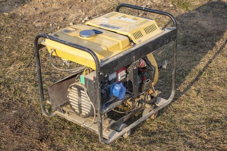 close-up. Street lighting. A gasoline-powered generator that produces current. Backup or emergency...