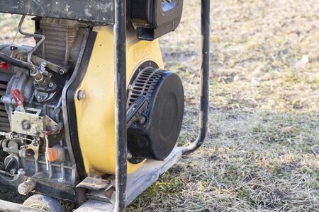 close-up. Street lighting. A gasoline-powered generator that produces current. Backup or emergency...