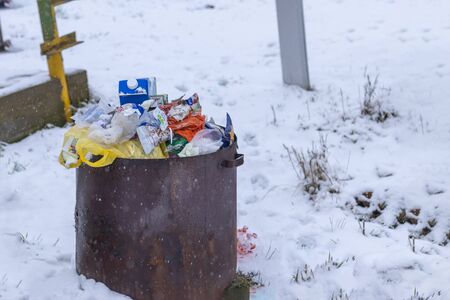 Minsk. Belarus, January 29, 2020. Burning garbage in a metal barrel. The concept of the destruction of the ozone layerのeditorial素材