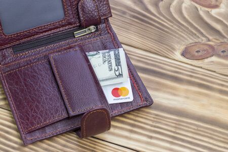 Minsk. Belarus. January 30, 2020 Wood background Bank card Close-up MasterCardのeditorial素材