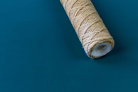A water filter whose cartridge needs to be replaced. Question mark. Close-up. On a wooden background. Copy spaceの写真素材