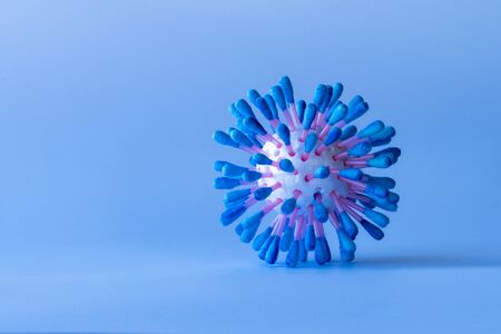blue background. It has a foam ball and cotton shelves painted blue. Molecule.