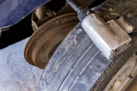 Workshop. Removed from a car wheel with a special tool. There is a lot of wear and damage on the...