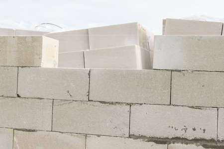 Street lighting. Start building a white block residential building. Laying takes place on an...