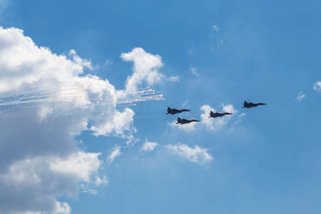 Daylight. combat vehicle aircraft in the amount of four pieces. blue skyの写真素材