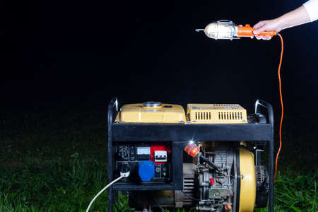 street lighting. night. The generator is yellow. Generates electricity. Used as a backup power supply.の写真素材