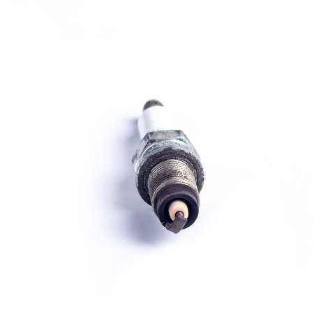 car candle. She stood on the car engine. On white background. Not new. Replacement requiredの写真素材