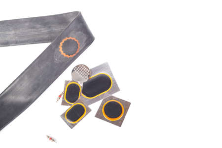 on white background. The camera from the bicycle on it is a patch of raw rubber. Close-up