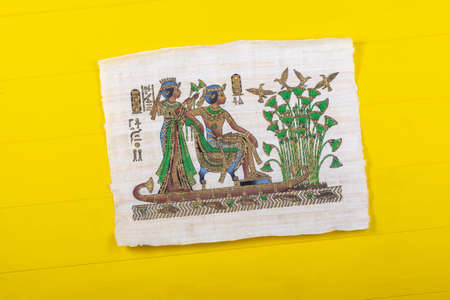 Retro style wood background painted yellow. Close-up. Cigarette