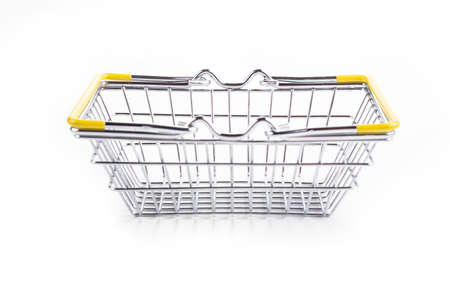 studio lighting. toy metal basket for products. On white background. Close-up