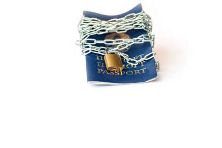 Studio lighting. the citizen's passport is tied with a metal chain in the center with a yellow lock....
