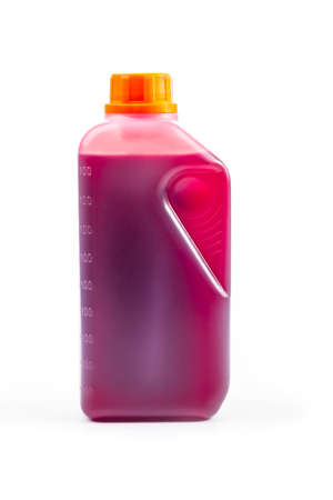 studio lighting. filmed on a white background. A plastic canister contains pink oil. Close-upの写真素材