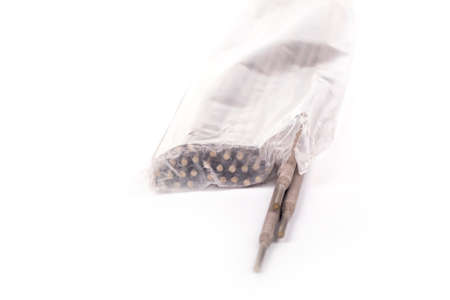 studio lighting. a pack of electrodes in a bag, several pieces pushed out of it. Close-upの写真素材
