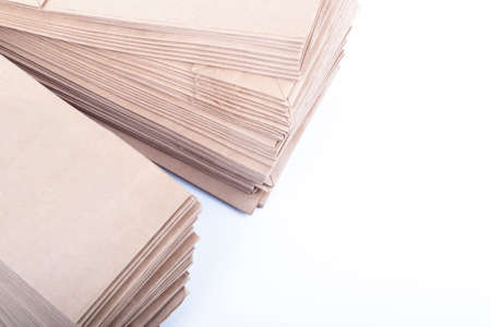 studio lighting. a stack of paper bags for recycling in the home. Second life to paper