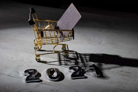 studio lighting. light in the dark is applied to a yellow metal trolley. Close-upの写真素材