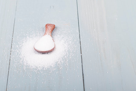 studio lighting. Retro style wooden background. sugar. Close-upの写真素材