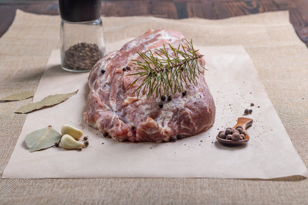 special paper for baking meat. Pork neck tenderloin. Also near spices and seasonings for its preparation,の写真素材