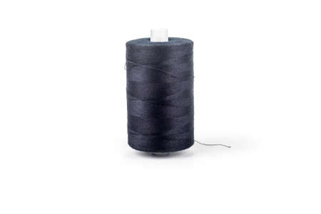 Studio lighting. on a white background, a spool of black thread. Close-up