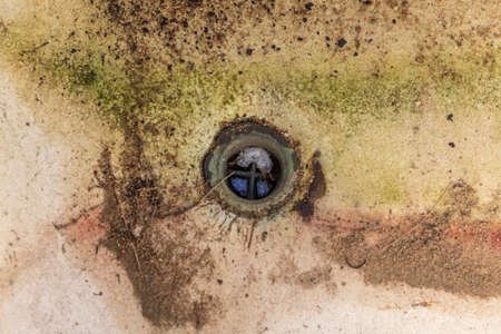 Street lighting. the old cast-iron tub is all ruined and covered in rust. Enamel peeled off.の写真素材