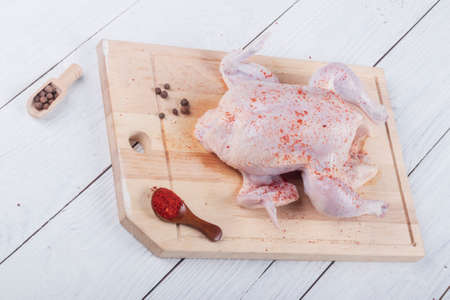 Studio lighting. chicken chicken. On a wooden background in retro style. Close-up.の写真素材
