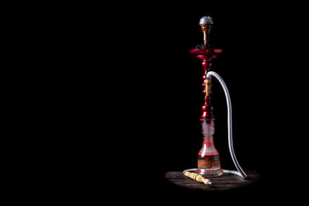 close-up. Hookah with a glass flask and a metal bowl hookah without smoke. Black background. Front viewの写真素材