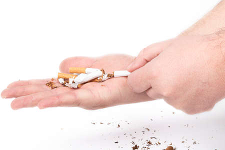 a human hand. the man on her hair. she breaks the cigarettes, and pours them into the other palm. on...