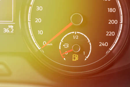discharge Fuel warning light on the dashboard of the car. The low fuel level is displayed on the...