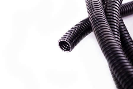 on a white background. black corrugated tube for laying cable in the car.の写真素材
