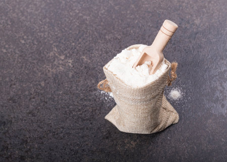 soft focus. a small bag made of retro-style drape. there is a spoon for spices of the MZ tree in it. close upの写真素材