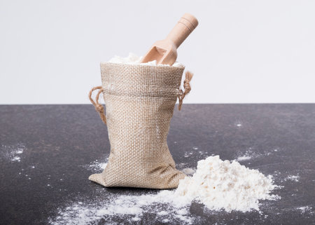 soft focus. a small bag made of retro-style drape. there is a spoon for spices of the MZ tree in it. close upの写真素材