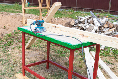 tree. natural wood in the shape of a rectangle. work piece. a man uses a tool to grind. sale