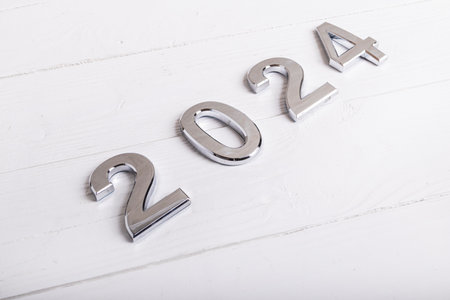 white retro wood background. figure. 2024. close-up concept