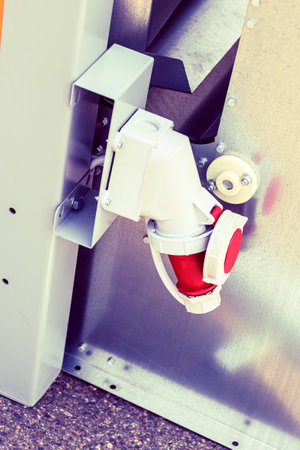 Industrial sockets and plugs on the distribution board. preparation of the construction site for power supply.の写真素材