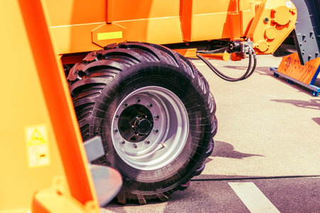 Dump truck wheels with all-season tires on an asphalt road. Close-up of the rear axles of the truckの写真素材