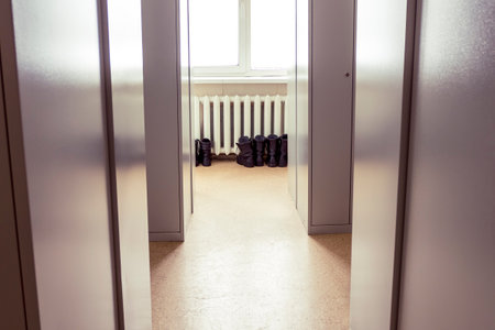 metal cabinet. cast iron radiator. shoes in it for dryingの写真素材