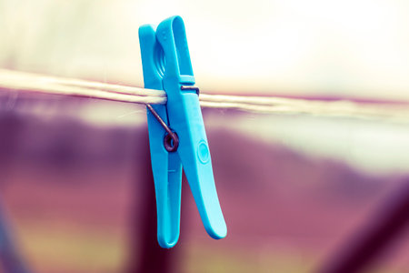 Colored clothespin on a rope natural light close-upの写真素材