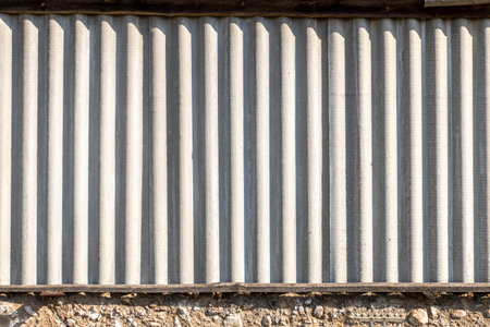 slate. texture of a corrugated sheet in the bright autumn sun. there is tintingの写真素材