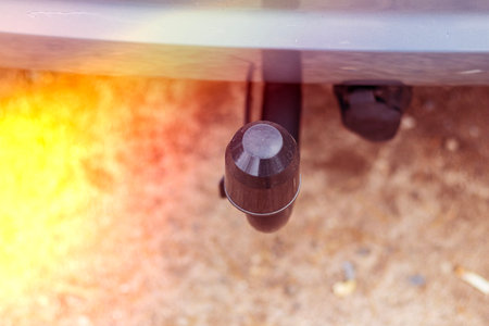 Here is a detailed view showcasing a tow hitch connector that is commonly used in vehicles for towing purposesの写真素材