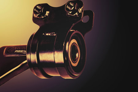 Close-up view of a car suspension component, illustrating detailed engineering and metallurgy.の写真素材